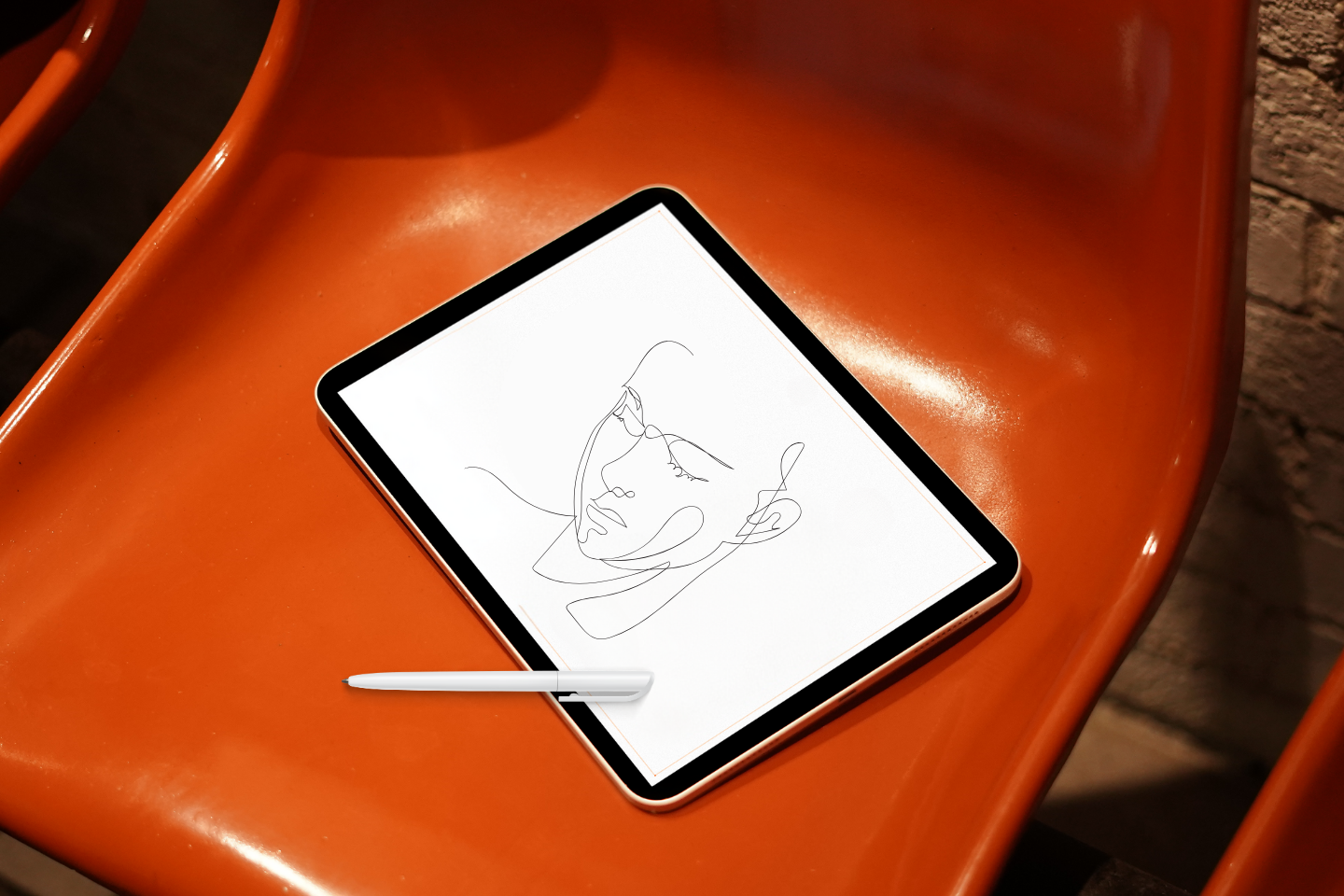 tablet displaying line drawing of a human face