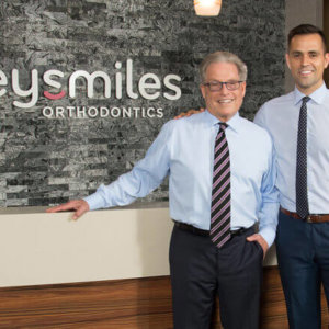 Orthodontists Dr. Gregg Frey and Dr. Daniel Frey at FreySmiles Orthodontics front desk